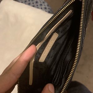 black Michael Kors wristlet